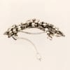 Petite barrette à cheveux argentée volutes Cemia